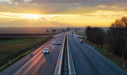 Highway transportation with cars at sunset traffic