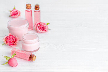 Skin care products with roses. Essential oil and liquid for spa treatment