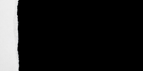 Obraz premium Torn open paper. Abstract rip vintage sheet frame. Old white torn paper texture isolated on black background. Crumpled backdrop surface placard with space for text.