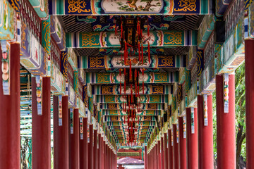 Chinese traditional corridor with painted palace lanterns in Baomo Garden, Guangzhou, China