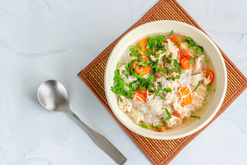 A Bowl of Fresh and Healthy Chicken Suop with a Spoon Top Down Photo