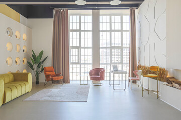 modern open-plan room interior in futuristic style in pastel colors with graphic wall decoration. very high ceilings and a huge window. soft stylish furniture with gold metallic elements