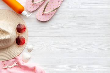 Frame of beach accessories with sraw hat, sunglasses and flip flops
