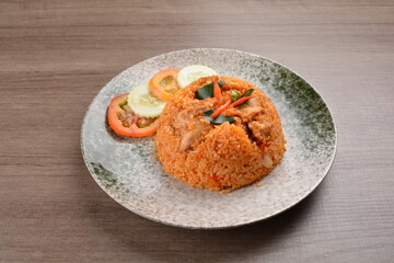 spicy chilli sambal chilli tomato wok fried rice nasi goreng on wood table asian halal menu