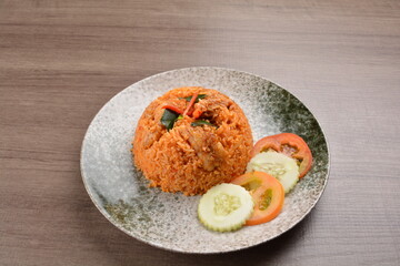 spicy chilli sambal chilli tomato wok fried rice nasi goreng on wood table asian halal menu