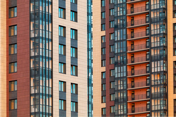 Fototapeta na wymiar Russia. Saint-Petersburg. Windows of a residential high-rise building.