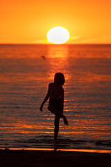 Russia. Saint-Petersburg. Citizens admire the sunset on the beach on the Gulf of Finland.