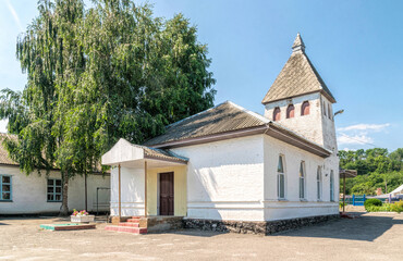 Fototapeta na wymiar Building of an old rural school in Ukraine. Art Nouveau architecture