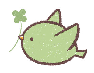 飛ぶ緑色の小鳥とクローバー