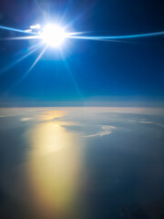 Fototapeta premium Aerial view from plane to morning sunrise over the ocean