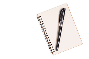 Top view of spiral kraft notebook front on white background.