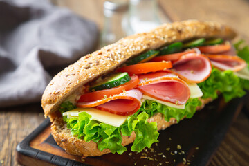 Large sandwich with ham, cheese and vegetables