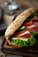 Large sandwich with ham, cheese and vegetables