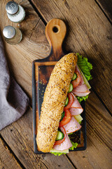 Large sandwich with ham, cheese and vegetables