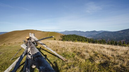 Dawn in the mountains. Landscape with a fence in the mountains. Old fence in the mountain