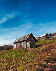 Shepherd's house in the mountains at sunrise in autumn