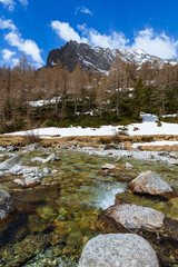 Fototapeta na wymiar The snow-capped mountains of Val Masino, during spring in the Italian Alps, near the town of San Martino, Italy - May 2021.
