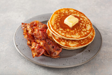 sweet pancakes with butter and bacon. traditional american breakfast