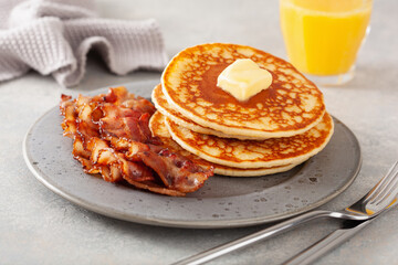 sweet pancakes with butter and bacon. traditional american breakfast