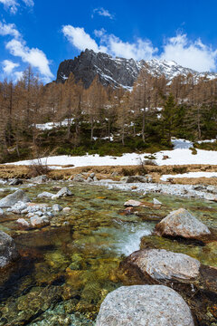 The snow-capped mountains of Val Masino, during spring in the Italian Alps, near the town of San Martino, Italy - May 2021.