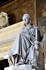 Fototapeta premium Tomb sculptures in the Monumental Cemetery at the Leaning Tower of Pisa