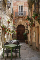 Fototapeta na wymiar one of the narrow, picturesque street in Tropea, very popular touristic town in Calabria, Italy