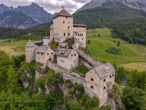 Drone view at Tarasp castle in the Swiss alps