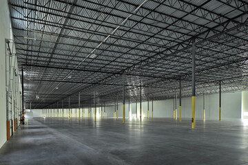 Large empty industrial warehouse storage building interior
