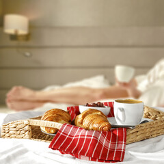 Fototapeta na wymiar Fresh breakfast in bed and woman body 
