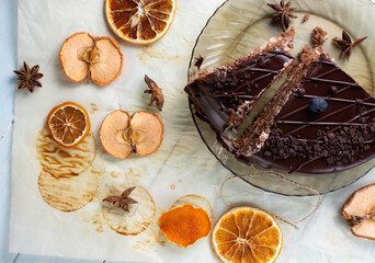 slice of chocolate cake with blueberries on top on gray background. top view.