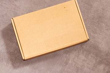 a box on concrete background for any business such as logo mockup, packaging mockup, branding, etc.
