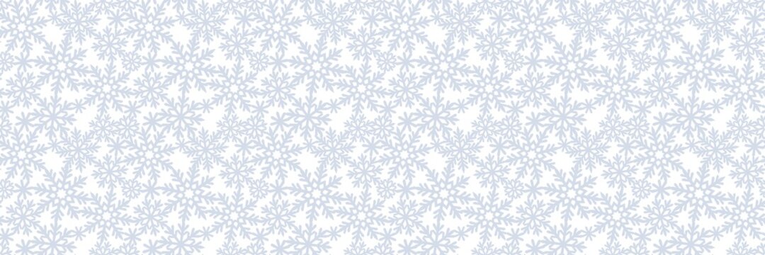 Long rectangular background with snowflakes. Seamless pattern on the theme of christmas, winter, snowfall. Gray silvery snow on white background. Endlessly repeating texture for fabrics, pillows, web.