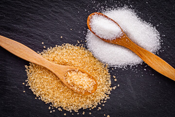 cane brown sugar on a dark stone background