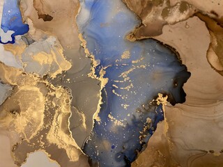 Abstract brown art with blue and gold — beige background, beautiful smudges and stains made with alcohol ink and golden paint. Blue fluid texture resembles tree bark, landscape, watercolor, aquarelle.