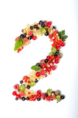 Number two from real natural berries and leaves. Numbers concept made from berries. Summer creative concept.