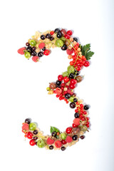 Number three from real natural berries and leaves. Numbers concept made from berries. Summer creative concept.