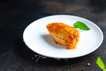 pepper stuffed rice vegetable tomato sauce fresh vegetables in plate on the table meal snack copy space food background rustic top view 