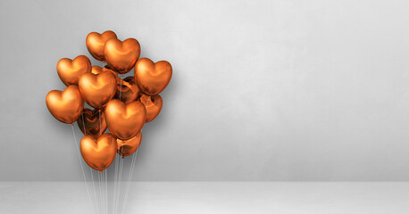 Copper heart shape balloons bunch on a white wall background. Horizontal banner.