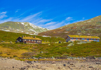 Vavatn lake panorama landscape cottages huts snowy mountains Hemsedal Norway.