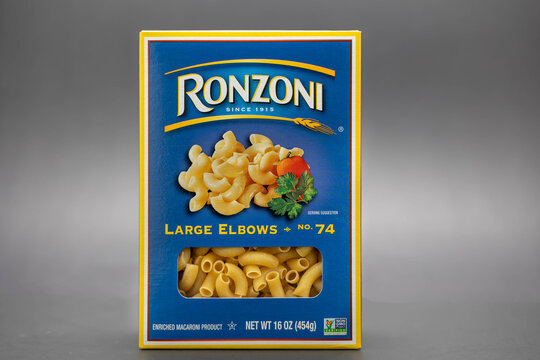 Fort Myers, FL, USA - 7-15-21: A one pound box of Ronzoni of large elbow pasta noodles isolated on black background Ronzoni is part of the Riviana Foods Inc