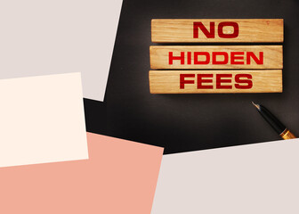 No hidden fees word written on wood block and luxury pen. Taxes and fees Financial business concept