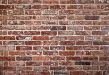 Stonewall – a brown bricks wall texture background. Architecture details with different shades 