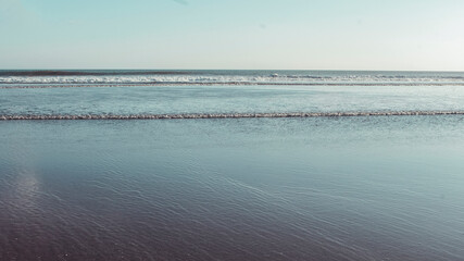 Obraz premium calm wave, blue ocean and blue sky daylight, tropical beach