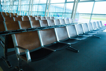 Deserted airport terminal. Rows of empty seats in the waiting room