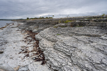 Fototapeta na wymiar A beautiful limestone formation with a dramatic sky in the background. Picture from the Baltic Sea
