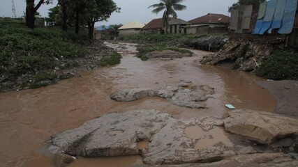 24th may 2021, Lagos Nigeria:  view of dirty river with muddy water in flooding period during heavy rains in Africa