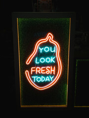 Neon sign saying you look fresh today
