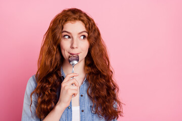 Photo of dreamy hungry young woman look empty space lick spoon isolated on pastel pink color background - obrazy, fototapety, plakaty