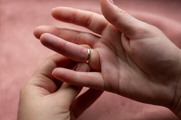 girl can not remove wedding ring close-up