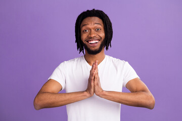 Portrait of attractive funky cheerful guy asking you request favor isolated over bright violet...